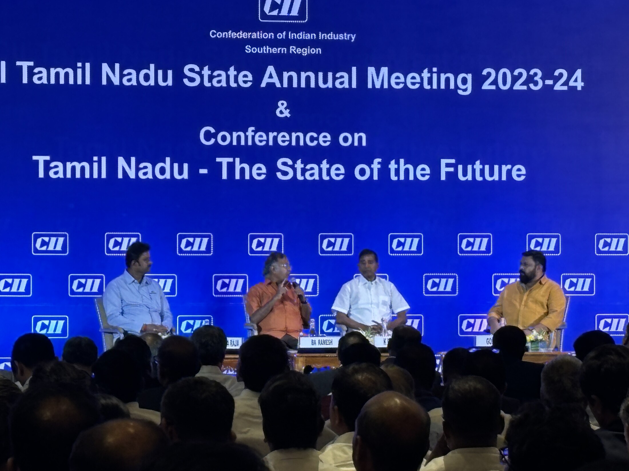CII Tamil Nadu State Annual Meeting panel discussion on stage with full LED backdrop